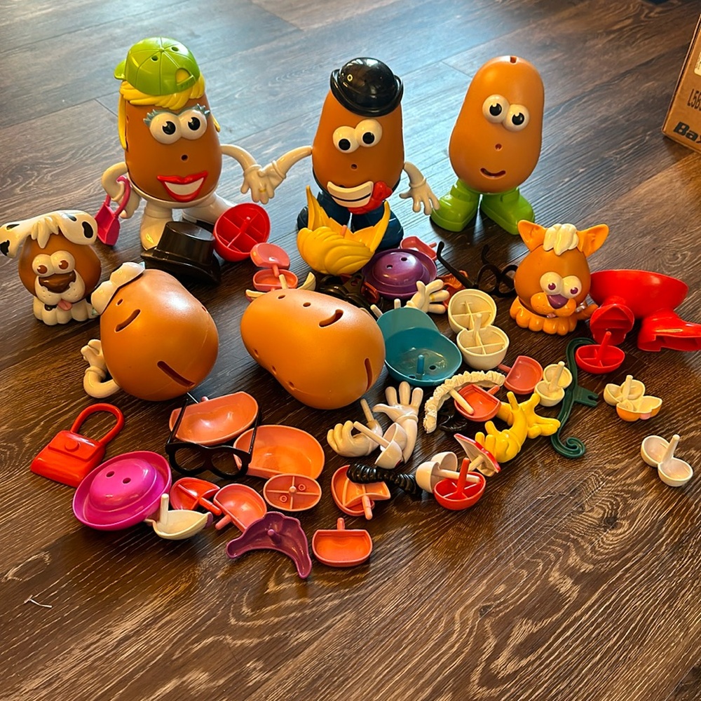 Lot of random Mr and Mrs Potato Head bodies and parts
